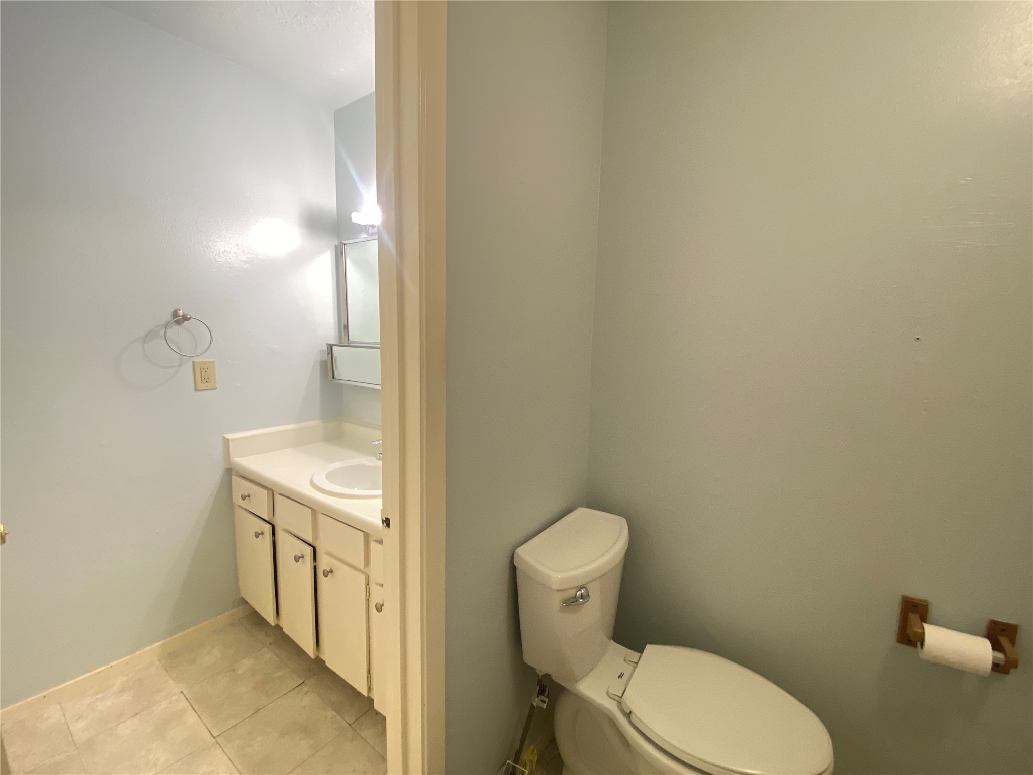 12177 Sharpview Drive Houston, TX 77072 - Photo 20 of 30 a bathroom with a granite countertop toilet and a sink
