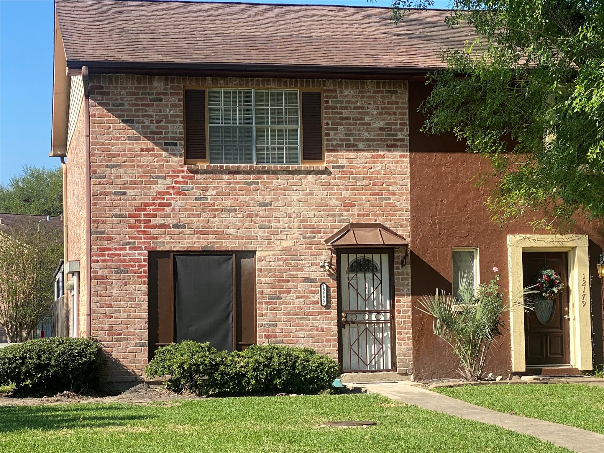 12177 Sharpview Drive Houston, TX 77072 - Photo 2 of 30 a front view of a house with garden