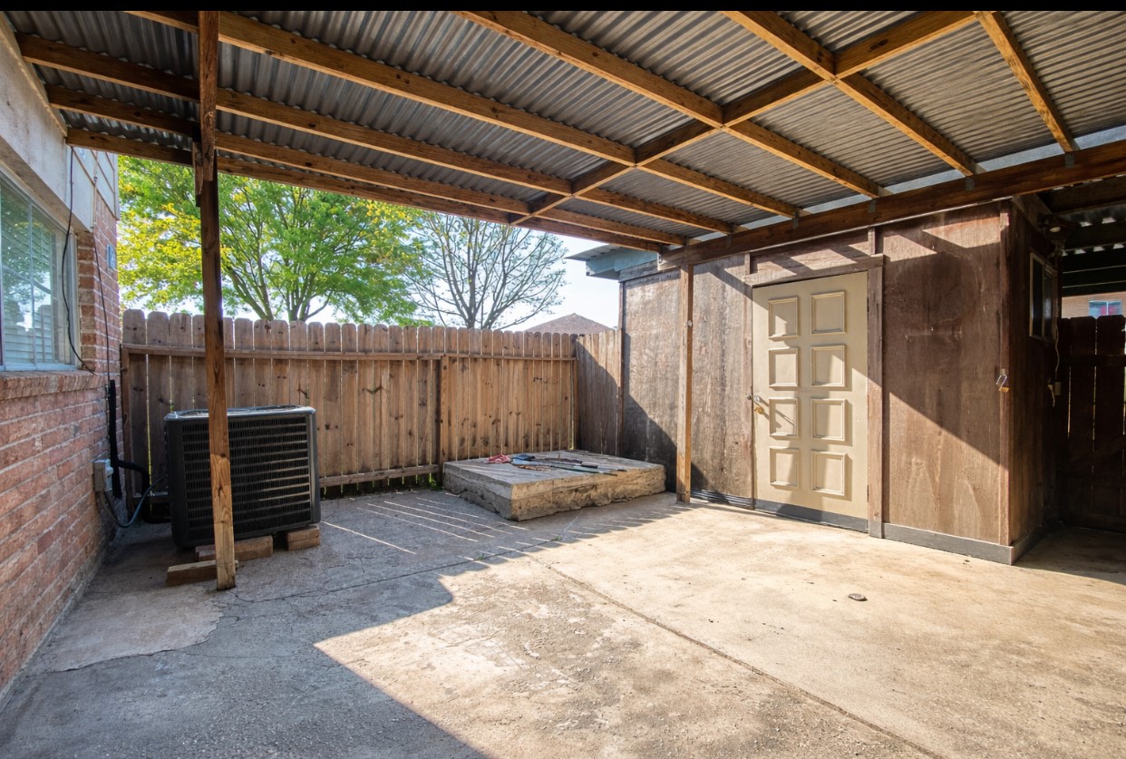 12177 Sharpview Drive Houston, TX 77072 - Photo 24 of 30 a backyard of a house with a large tree and wooden fence