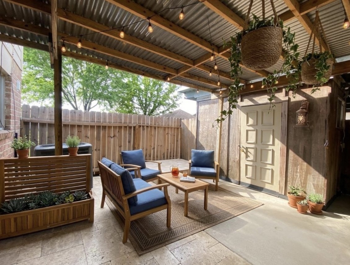 12177 Sharpview Drive Houston, TX 77072 - Photo 25 of 30 a view of a patio with a table and chairs