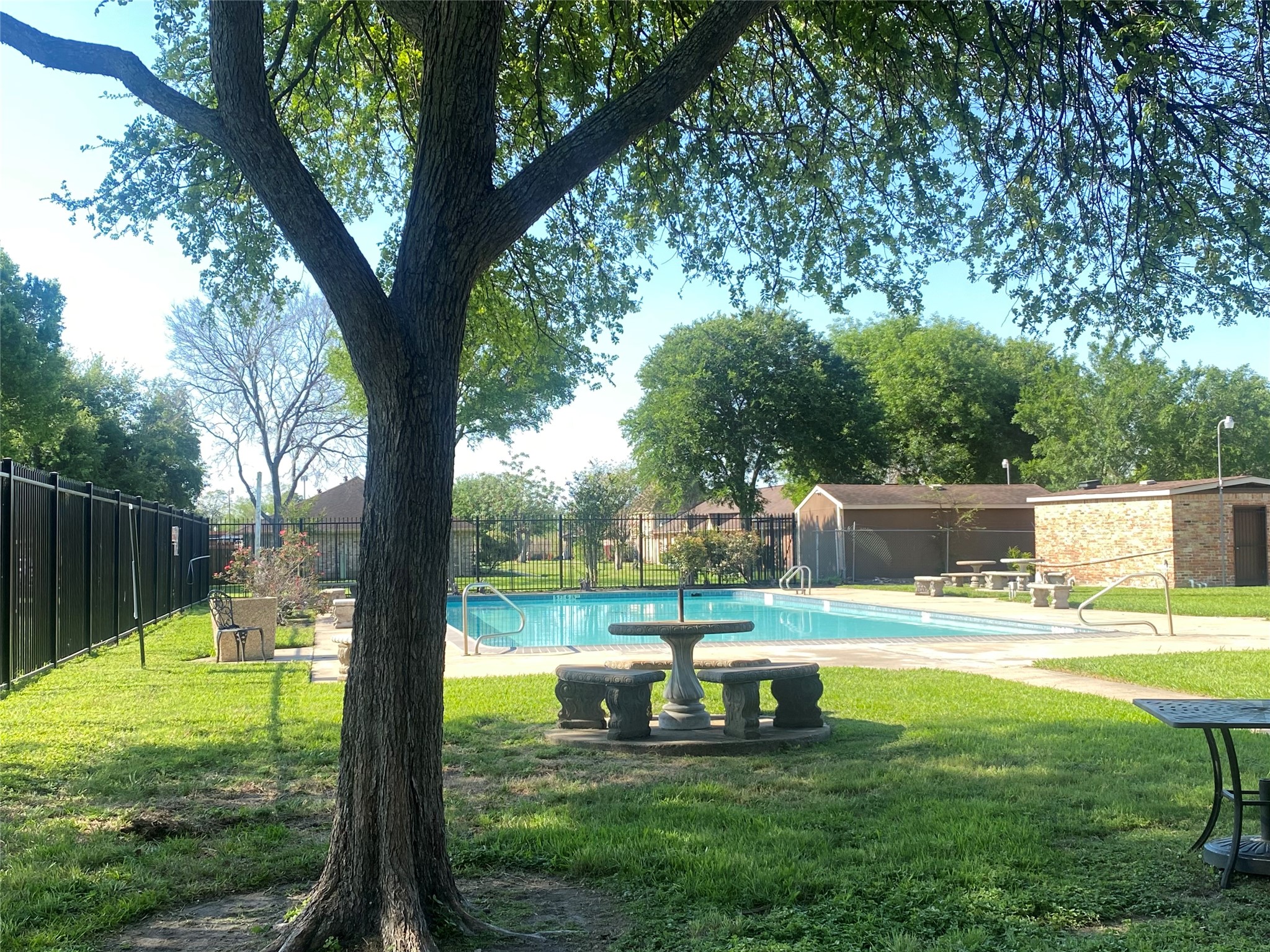 12177 Sharpview Drive Houston, TX 77072 - Photo 26 of 30 a swimming pool with lots of green space and garden view