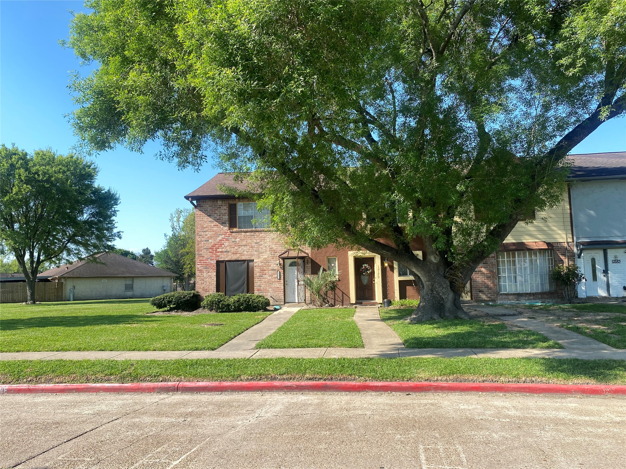 12177 Sharpview Drive Houston, TX 77072 - Photo 5 of 30 a view of house with yard and tree in front of it