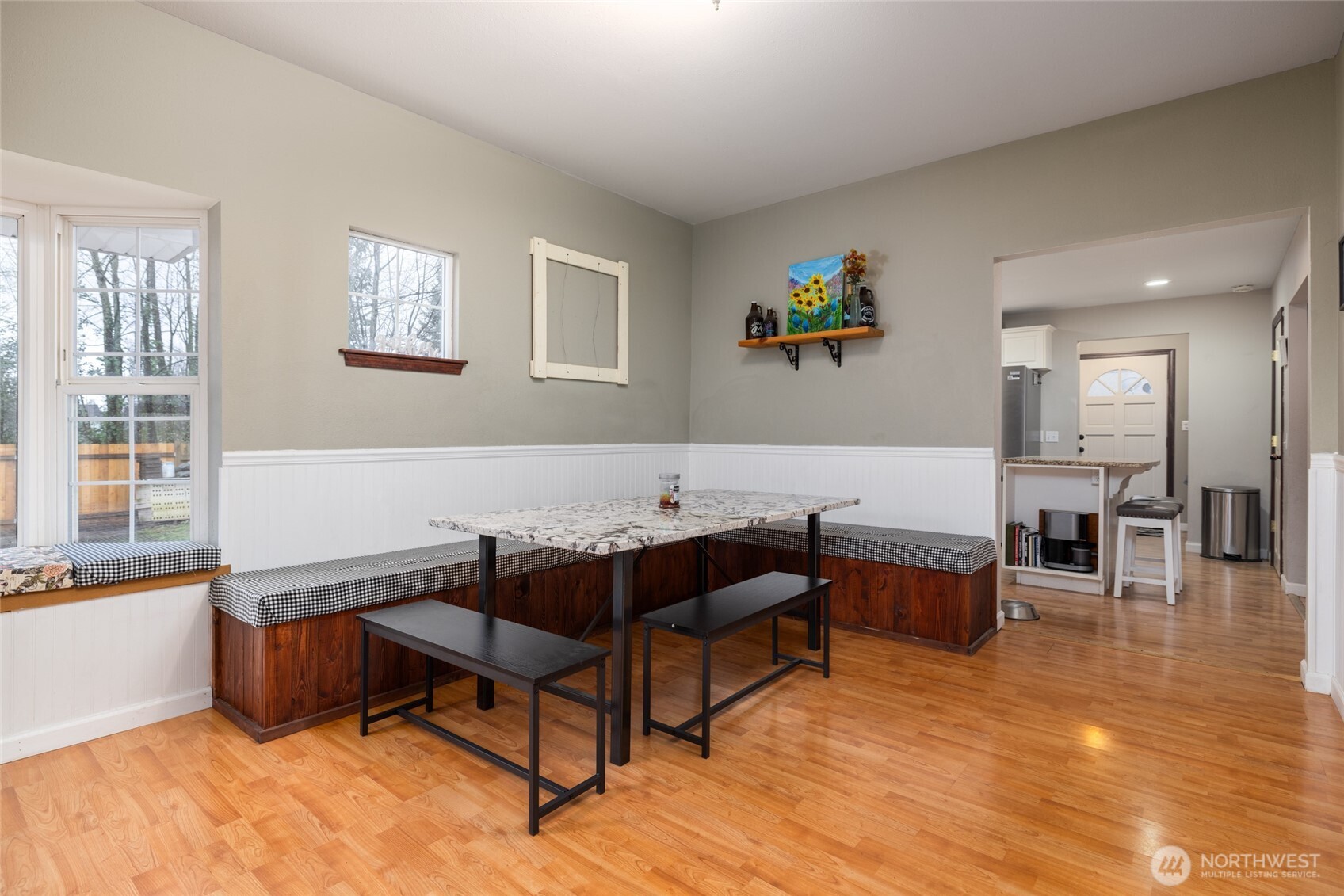 9543 Columbia Way Sedro-Woolley, WA 98284 - Photo 23 of 38 a living room with furniture and a dining table with wooden floor