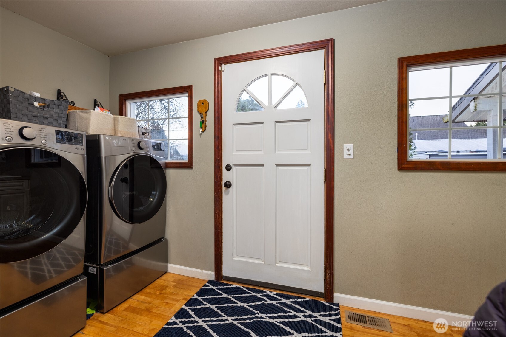 9543 Columbia Way Sedro-Woolley, WA 98284 - Photo 25 of 38 a bedroom with a bed and wooden floor