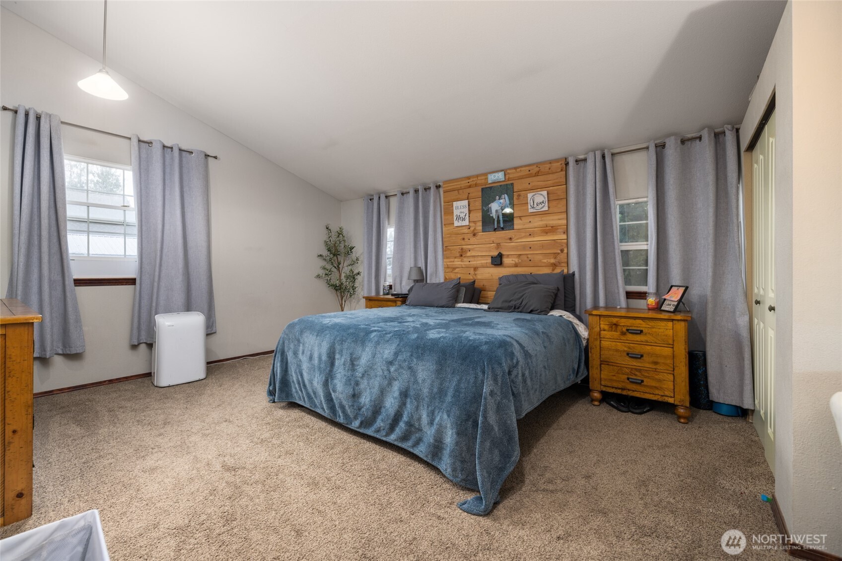 9543 Columbia Way Sedro-Woolley, WA 98284 - Photo 27 of 38 a bedroom with a bed and large windows
