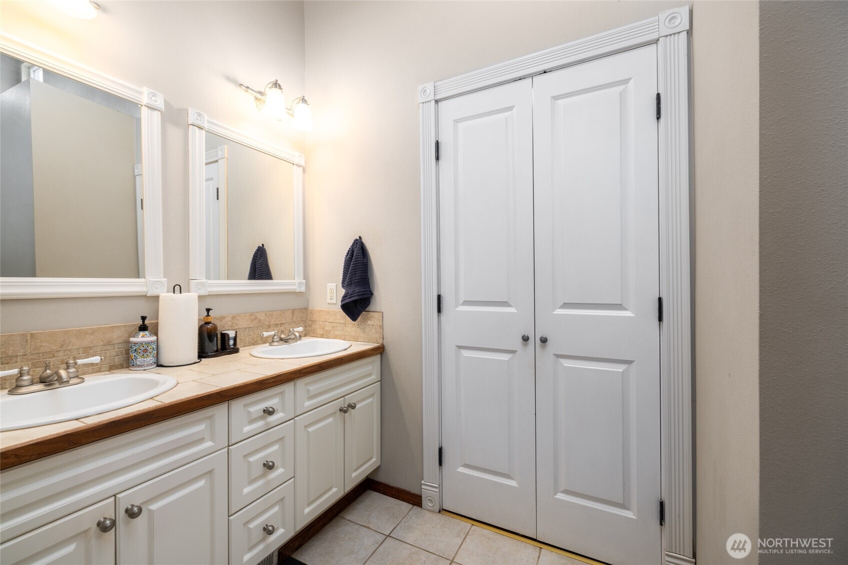 9543 Columbia Way Sedro-Woolley, WA 98284 - Photo 29 of 38 a spacious bathroom with a double vanity sink a mirror and a shower