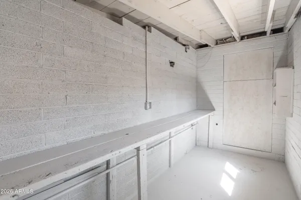 a view of a storage and utility room with closet