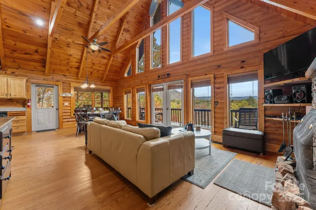 a living room with furniture cabinets and a flat screen tv