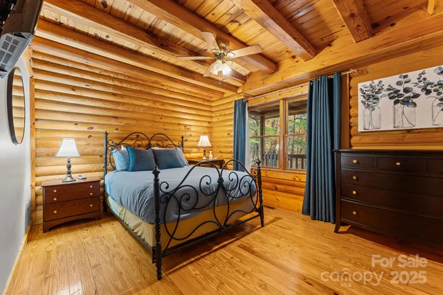 a bed sitting in a bedroom next to a window