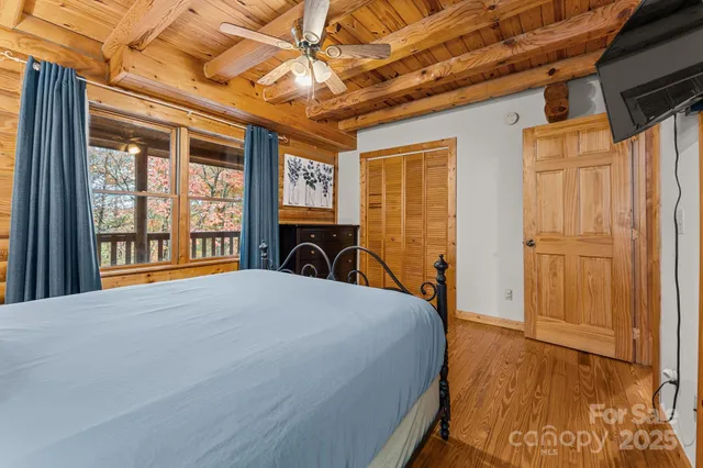 a bed room with a bed and a window