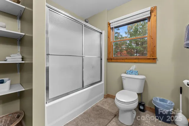 a white toilet sitting next to a bathroom sink