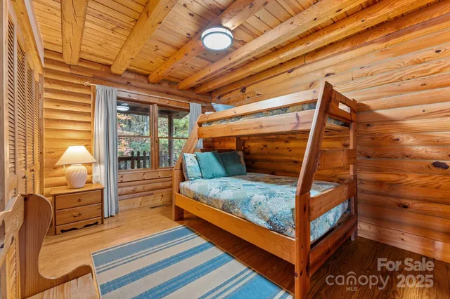 a bedroom with furniture and a window