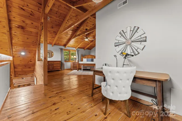 a view of an entryway with wooden floor