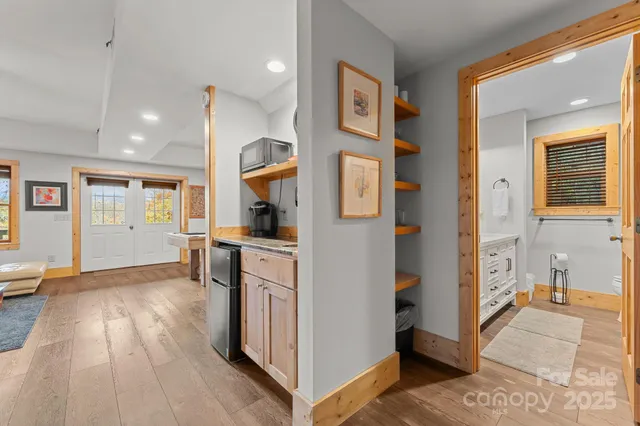 a view of kitchen with furniture and wooden floor
