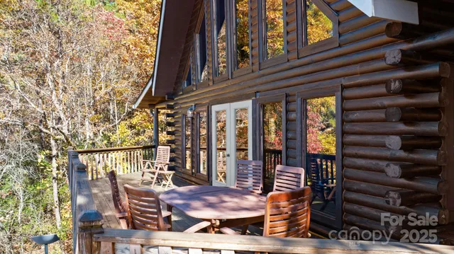 a view of balcony with wooden floor and outdoor seating