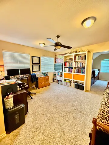 a bedroom with furniture and window