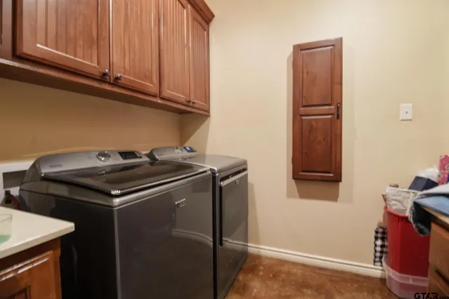 a large room with a large window and chandelier