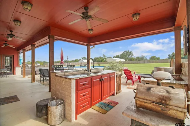 a view of a patio with a table and chairs