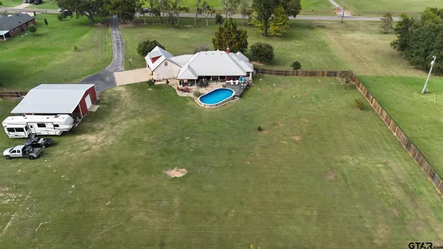 a view of a house with a big yard