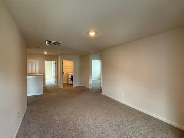 a view of livingroom with furniture and windows