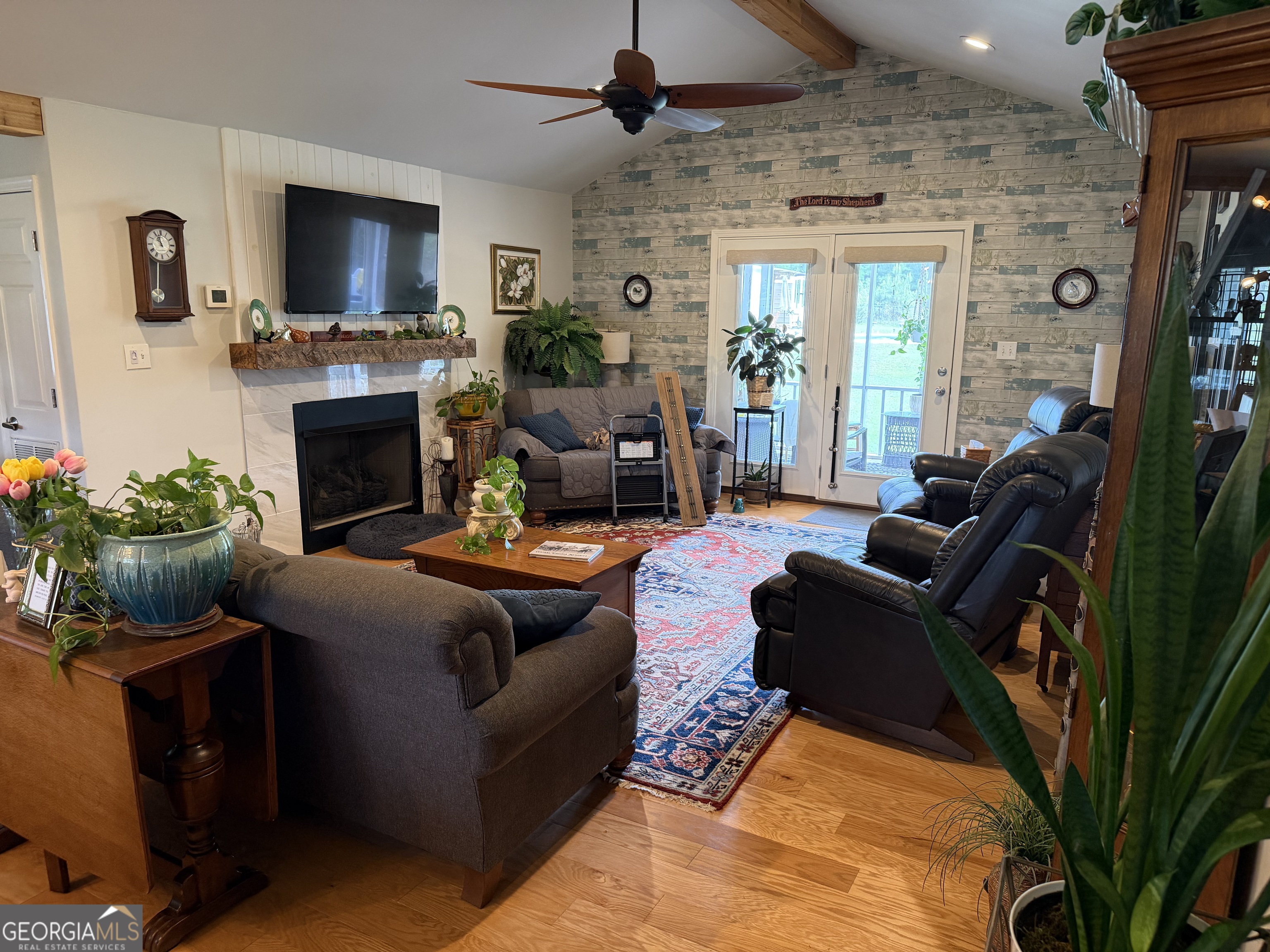848 Tanglewood Circle Dublin, GA 31021 - Photo 13 of 21 a living room with furniture a flat screen tv and a fireplace