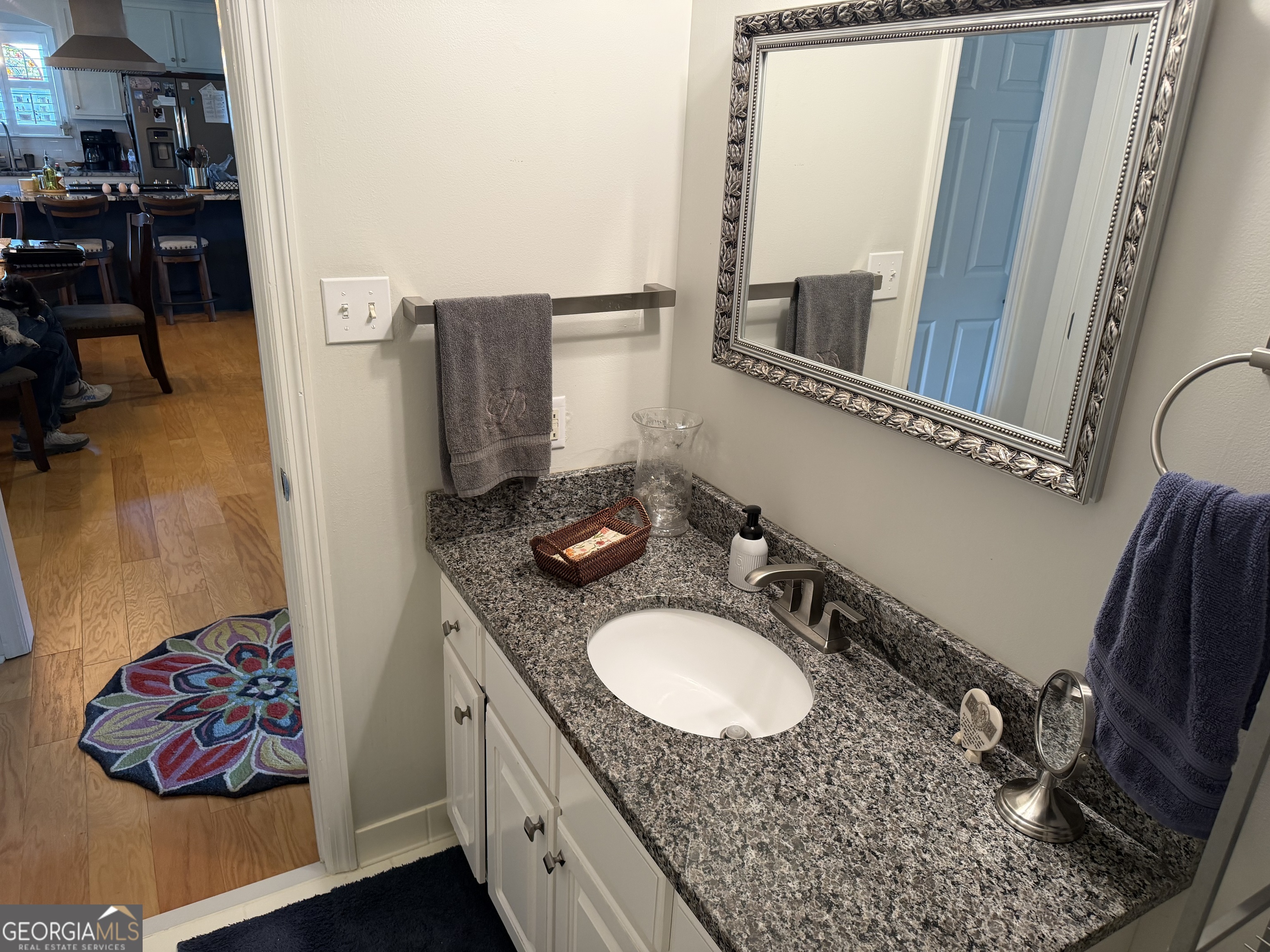 848 Tanglewood Circle Dublin, GA 31021 - Photo 16 of 21 a bathroom with a sink vanity and mirror