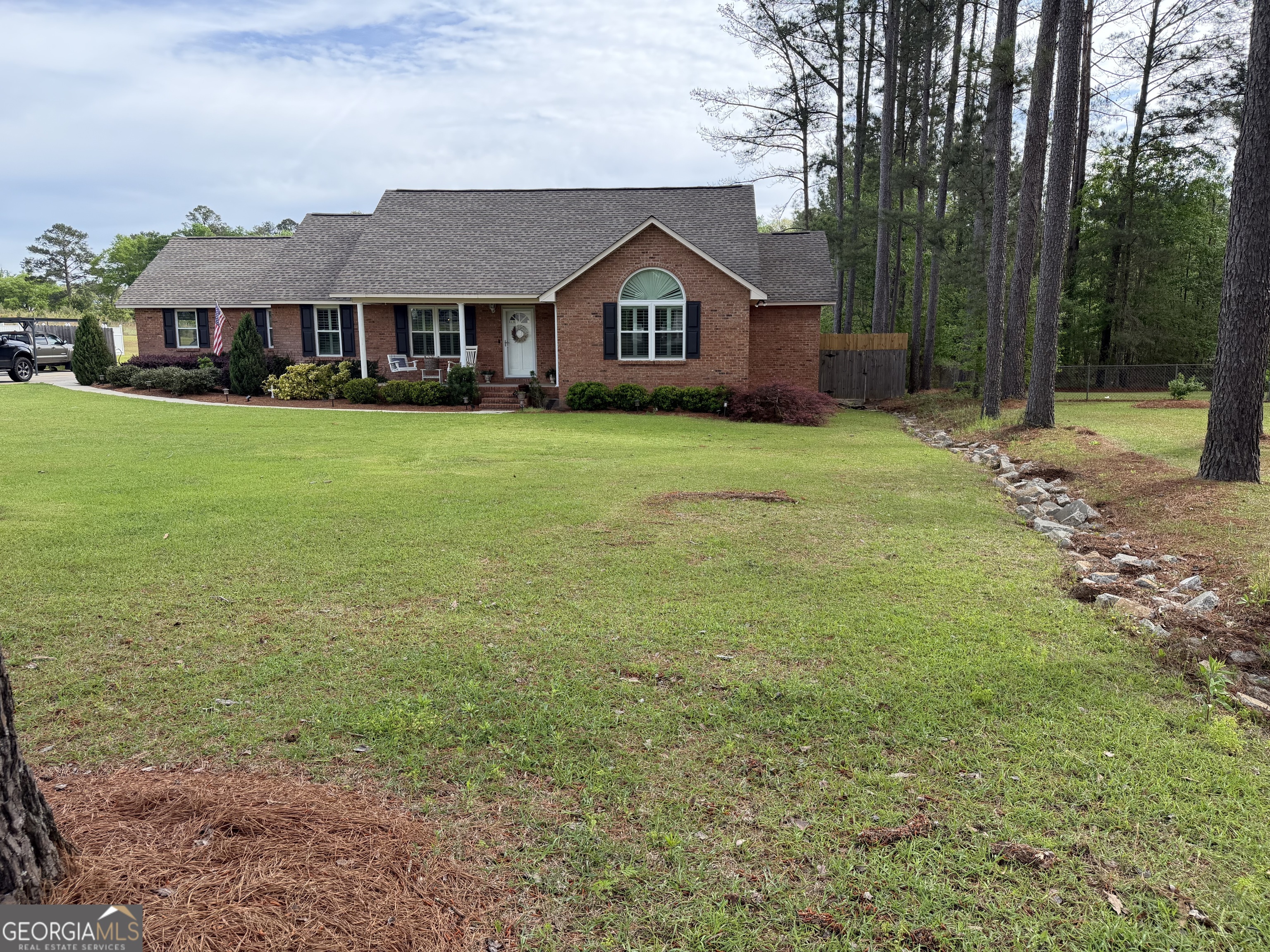 848 Tanglewood Circle Dublin, GA 31021 - Photo 2 of 21 a front view of a house with a garden