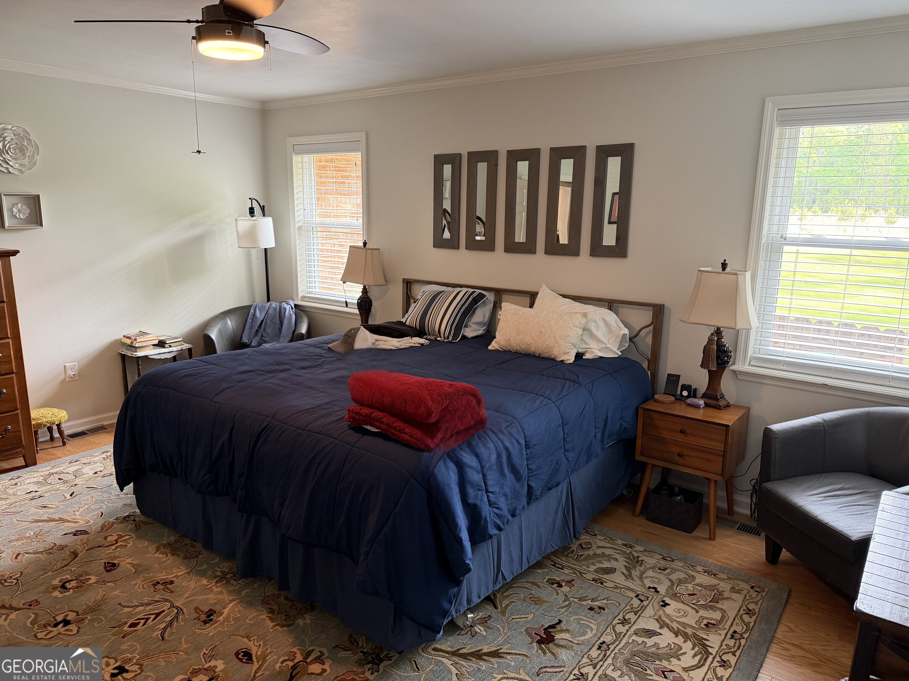 848 Tanglewood Circle Dublin, GA 31021 - Photo 4 of 21 a bedroom with a bed a couch and a window