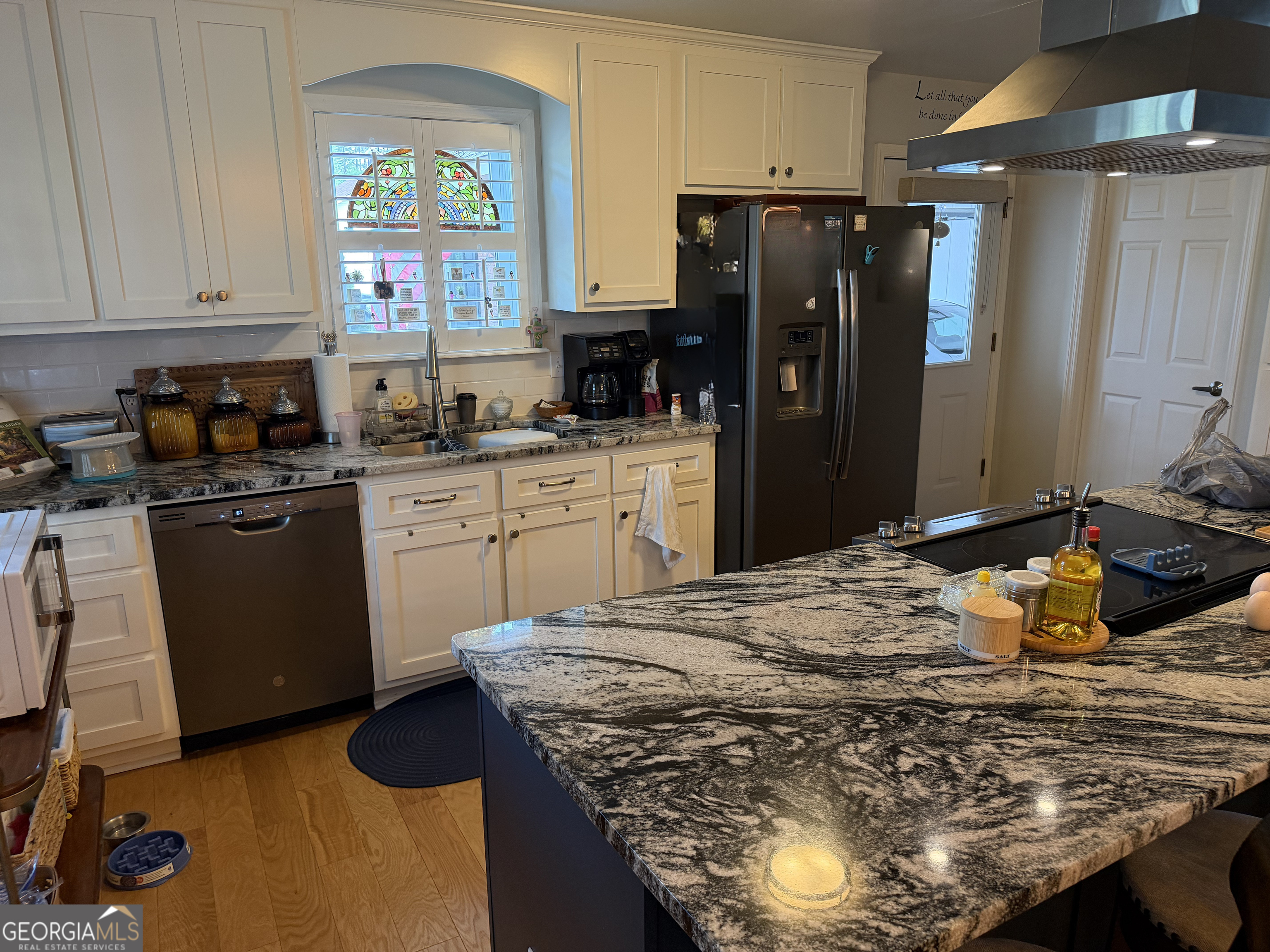 848 Tanglewood Circle Dublin, GA 31021 - Photo 10 of 21 a kitchen with stainless steel appliances granite countertop a sink stove and refrigerator