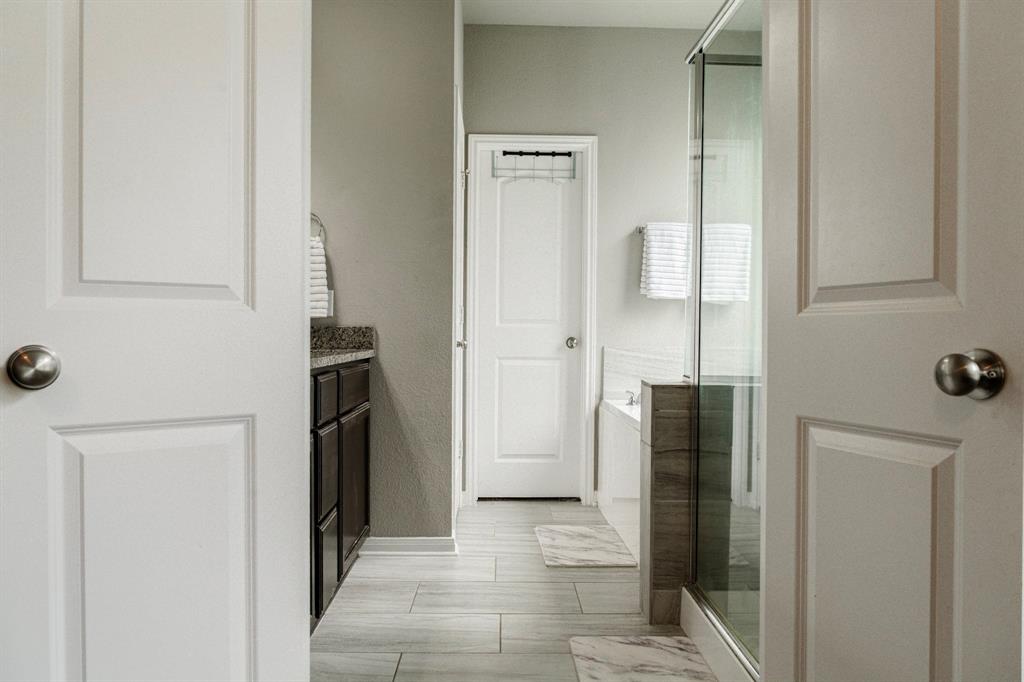 2716 Beutel Road Lorena, TX 76655 - Photo 16 of 39 a view of a hallway with refrigerator and cabinet