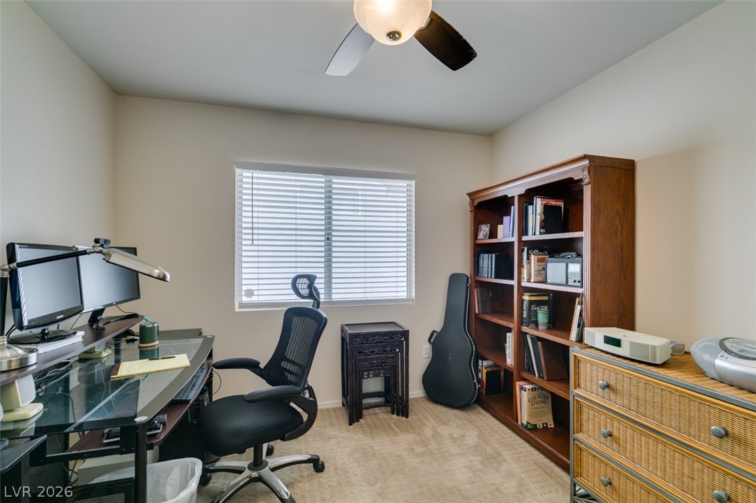2187 Chapman Ranch Drive Henderson, NV 89012 - Photo 20 of 26 This bright bedroom offers lots of space and closet area.