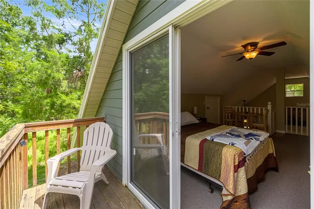 a bedroom with furniture and a window