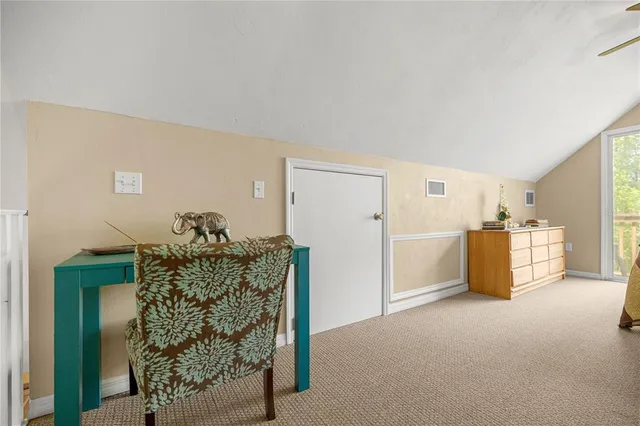 a view of a livingroom with furniture and cabinet