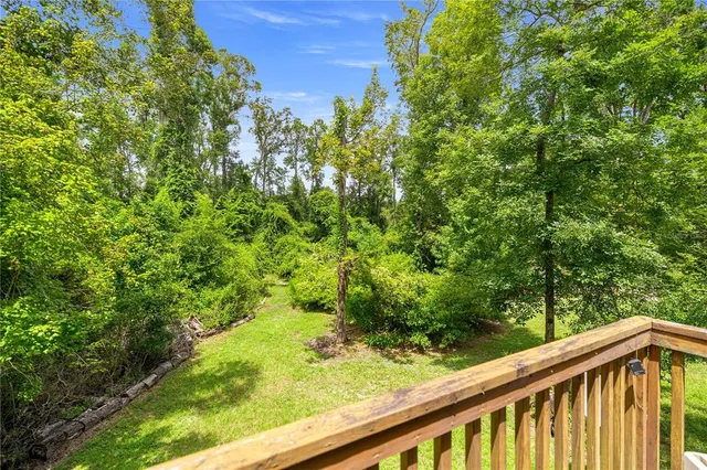 a view of a yard with a tree