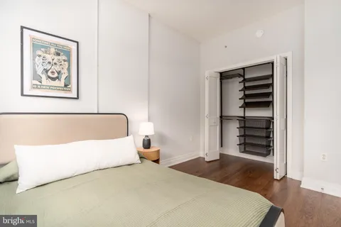 a bedroom with a bed and a walk in closet