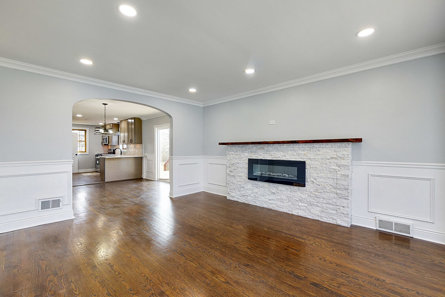 1923 186th Place Homewood, IL 60430 - Photo 13 of 39 an empty room with wooden floor and a fireplace