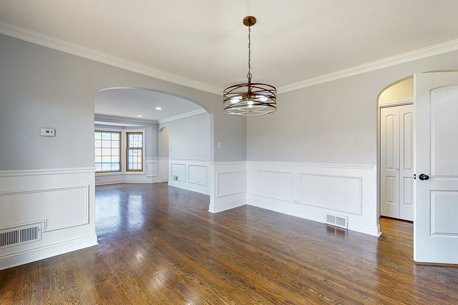 1923 186th Place Homewood, IL 60430 - Photo 14 of 39 a view of a room with wooden floor staircase and a kitchen