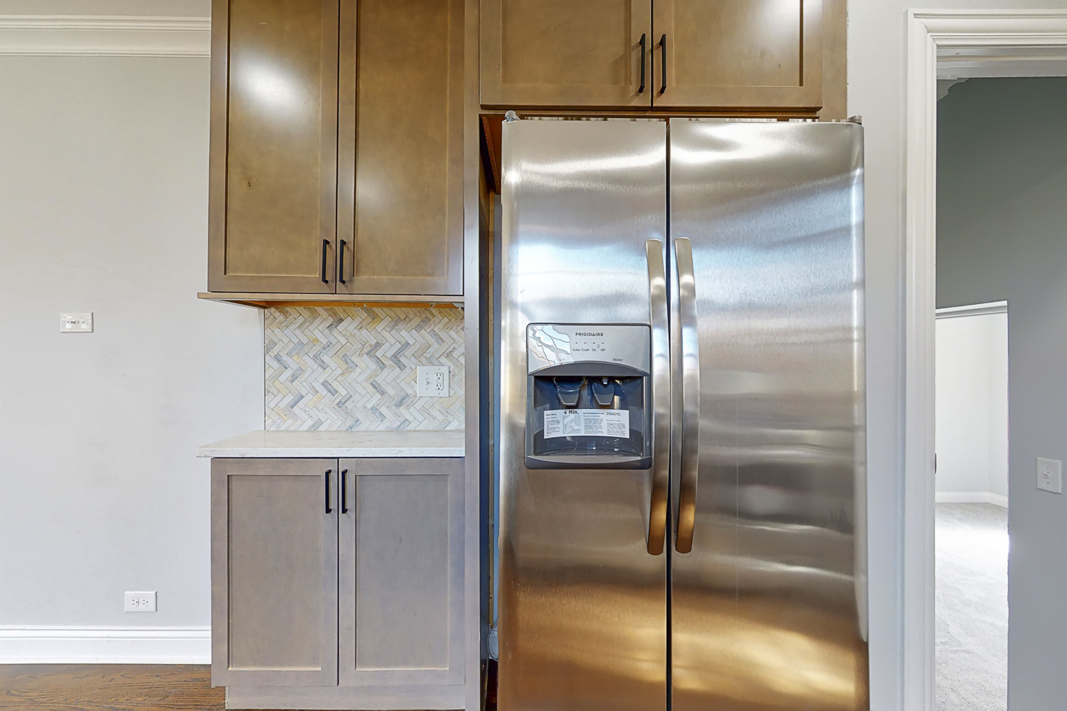 1923 186th Place Homewood, IL 60430 - Photo 17 of 39 a kitchen with a refrigerator and a wooden floor