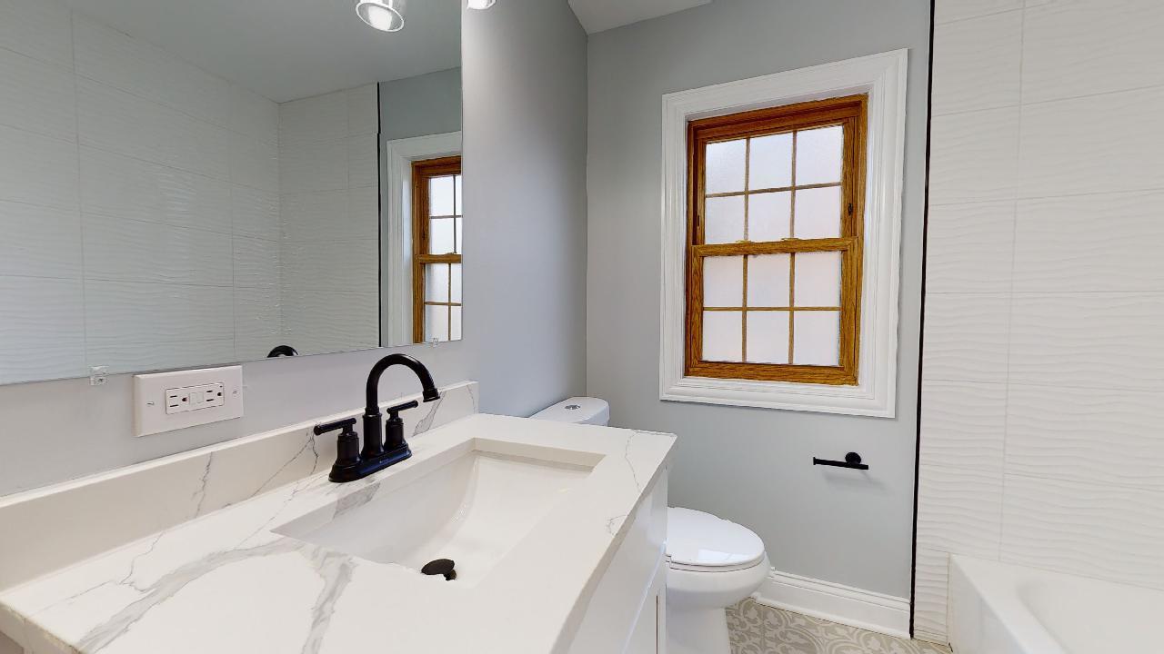 1923 186th Place Homewood, IL 60430 - Photo 19 of 39 a bathroom with a sink toilet and a mirror