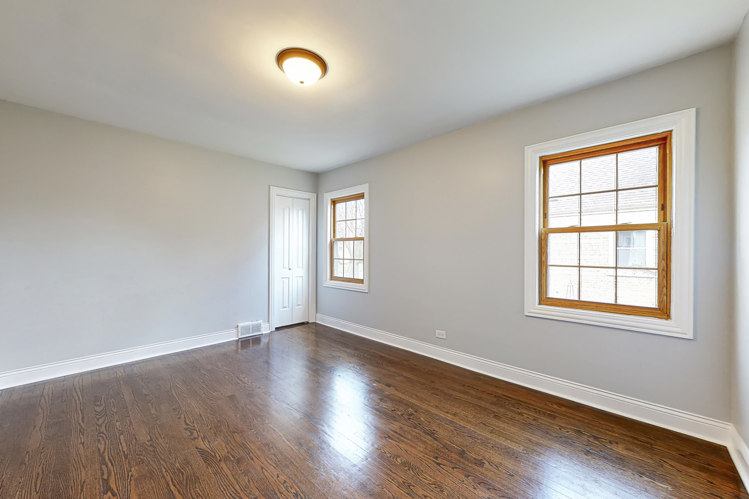 1923 186th Place Homewood, IL 60430 - Photo 21 of 39 a view of an empty room with wooden floor and a window