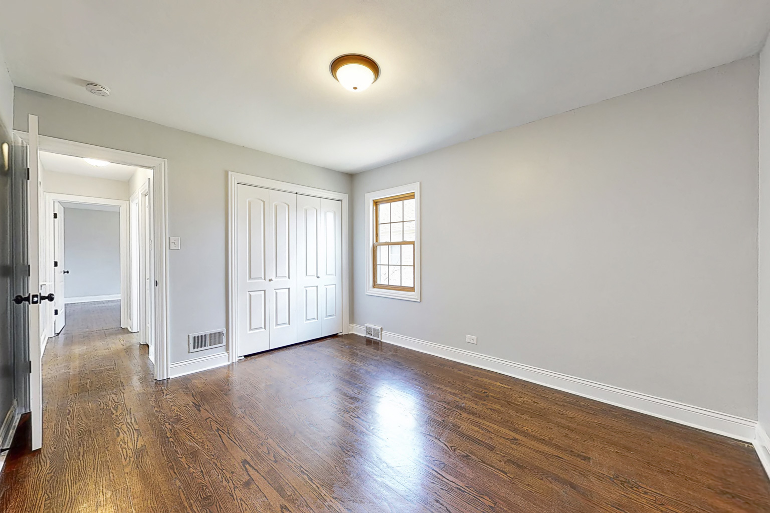 1923 186th Place Homewood, IL 60430 - Photo 23 of 39 a view of an empty room with wooden floor and a window