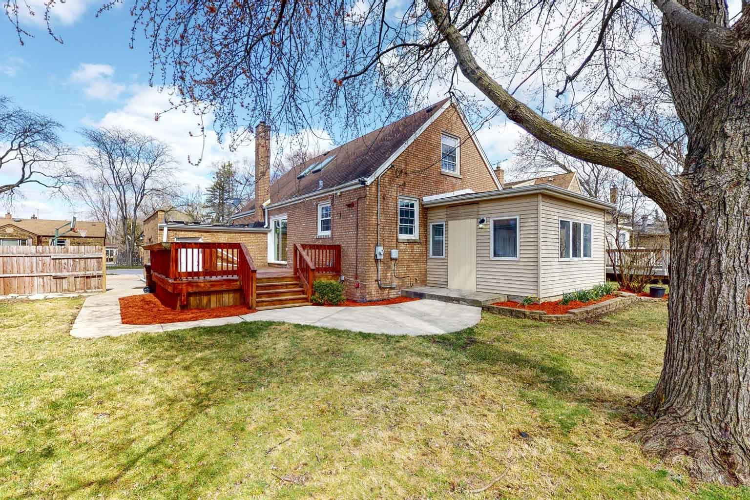 1923 186th Place Homewood, IL 60430 - Photo 10 of 39 a view of a house with a yard patio and fire pit
