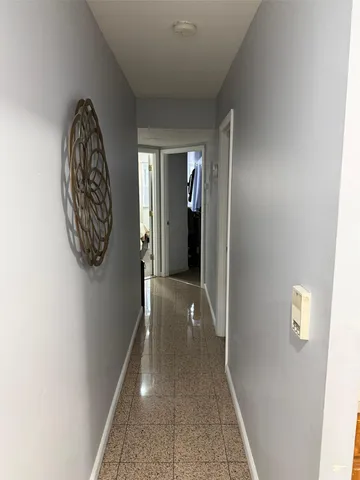 a view of a hallway with entryway