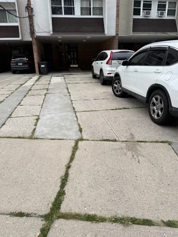 a view of a car parked in front of a house