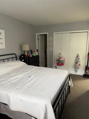 a bedroom with a bed and a table