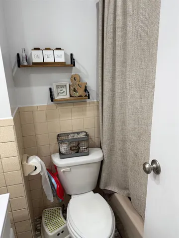 a bathroom with a toilet and a sink