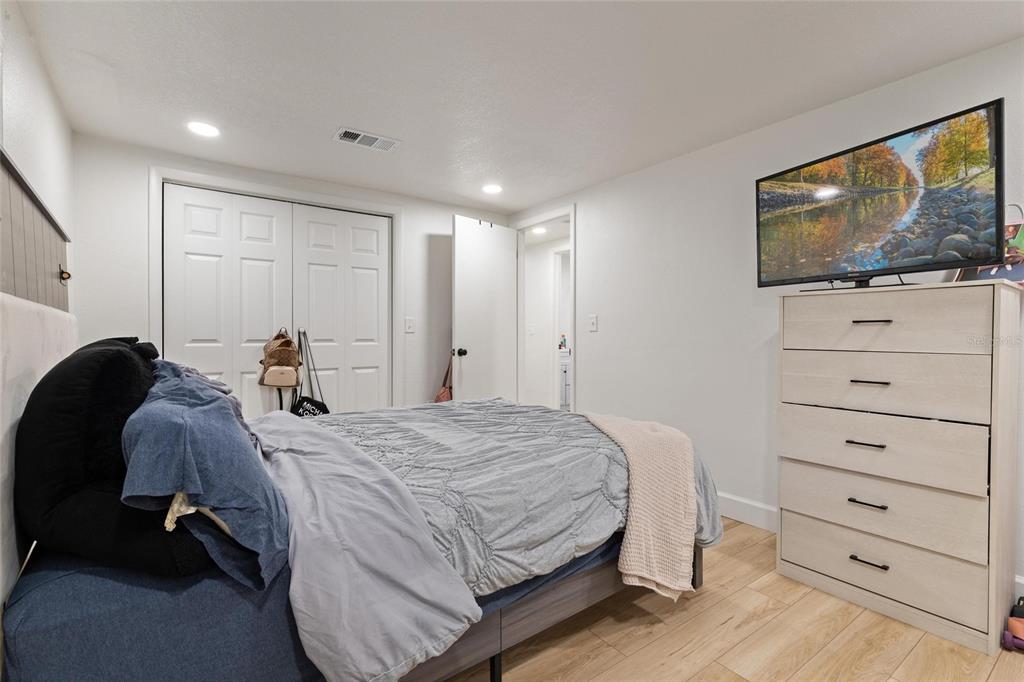 5707 Tennessee Avenue New Port Richey, FL 34652 - Photo 22 of 26 a bed room with a bed and a television