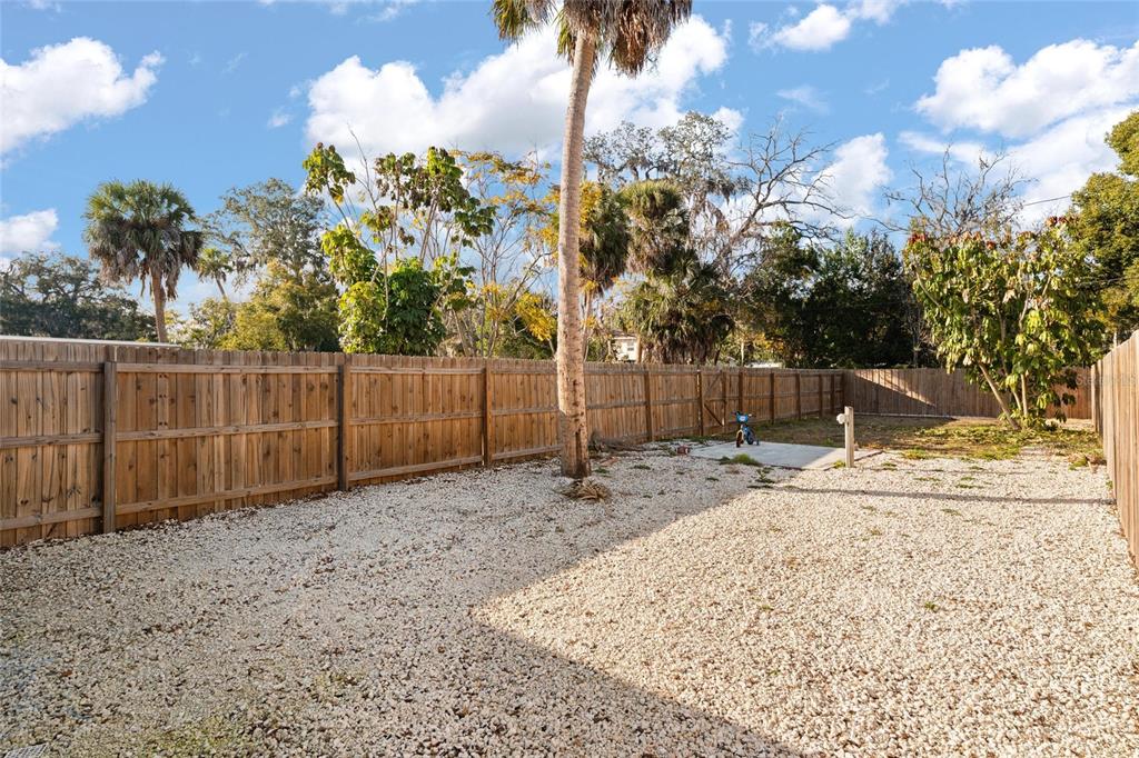 5707 Tennessee Avenue New Port Richey, FL 34652 - Photo 23 of 26 a backyard of a house with lots of green space