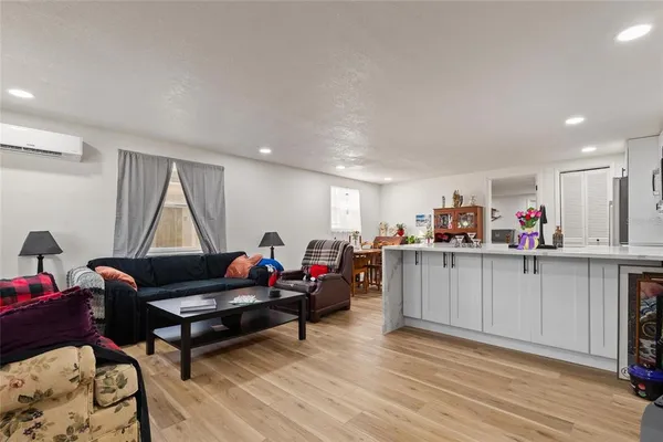 a group of people sitting in a living room