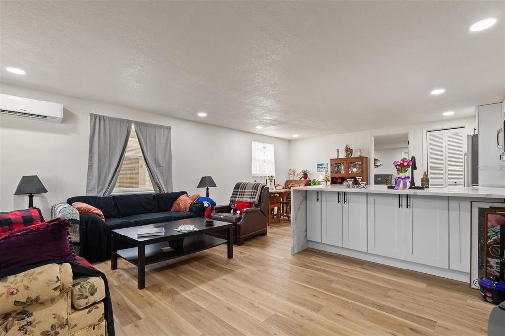 5707 Tennessee Avenue New Port Richey, FL 34652 - Photo 3 of 26 a living room with furniture and a wooden floor